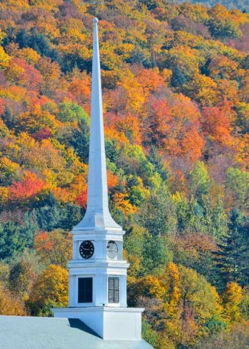 Steeple against Vermont fall foliage